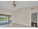Bedroom with sliding glass doors that open to the screened in pool and spa at 2442 Rio De Janeiro Ave, Punta Gorda, FL 33983