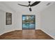 Bedroom featuring wood flooring and sliding glass doors overlooking the pool at 2442 Rio De Janeiro Ave, Punta Gorda, FL 33983