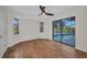 Bedroom with wood floors, bay window, and sliding doors to pool area at 2442 Rio De Janeiro Ave, Punta Gorda, FL 33983