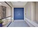 Inviting entryway with a double door painted in bright blue offering a warm welcome at 2442 Rio De Janeiro Ave, Punta Gorda, FL 33983