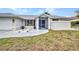 Charming home featuring a well-manicured lawn, white gravel accents, and blue potted plants at 2442 Rio De Janeiro Ave, Punta Gorda, FL 33983