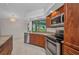 Bright kitchen with stainless appliances, granite counters and a view to the lake at 2442 Rio De Janeiro Ave, Punta Gorda, FL 33983