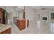 Open-concept living room featuring tile flooring and a modern fireplace at 2442 Rio De Janeiro Ave, Punta Gorda, FL 33983