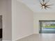 Bright living room with tile flooring and sliding glass doors leading to the screened in pool area at 2442 Rio De Janeiro Ave, Punta Gorda, FL 33983