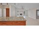Open living area next to the kitchen, complete with tile flooring and a cozy fireplace at 2442 Rio De Janeiro Ave, Punta Gorda, FL 33983