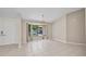 Bright, airy living room with a large window, tiled flooring, and natural light, offering a flexible and welcoming space at 2442 Rio De Janeiro Ave, Punta Gorda, FL 33983