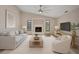 Inviting living room with a cozy fireplace, neutral decor, and comfortable seating, creating a relaxing space for gatherings at 2442 Rio De Janeiro Ave, Punta Gorda, FL 33983