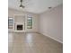 Bright living room with tile floors, lots of light, and a modern fireplace at 2442 Rio De Janeiro Ave, Punta Gorda, FL 33983