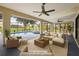 Spacious screened-in patio featuring a pool, hot tub, and comfortable outdoor seating at 2442 Rio De Janeiro Ave, Punta Gorda, FL 33983