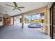 Enclosed pool and spa area on lanai with ceiling fans at 2442 Rio De Janeiro Ave, Punta Gorda, FL 33983
