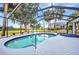 Screened pool and spa with tropical palm tree views at 2442 Rio De Janeiro Ave, Punta Gorda, FL 33983