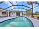 Screened pool and lanai with backyard view of home at 2442 Rio De Janeiro Ave, Punta Gorda, FL 33983