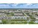A long shot of Sunrise Towers, displaying its canal-front location and proximity to nearby businesses at 2486 Caring Way # 14A, Port Charlotte, FL 33952