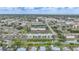 Aerial view of Sunrise Towers complex, situated near a canal with views of community and landscape at 2486 Caring Way # 14A, Port Charlotte, FL 33952