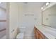 Bathroom featuring a vanity with ample countertop space and a walk-in shower at 2486 Caring Way # 14A, Port Charlotte, FL 33952