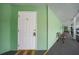 Exterior entrance to the unit featuring a white door with a 14 A address number at 2486 Caring Way # 14A, Port Charlotte, FL 33952