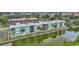 Waterfront condo complex featuring balconies and easy access to the water and scenic views at 2486 Caring Way # 14A, Port Charlotte, FL 33952