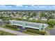 Aerial view of community with lush landscaping and canal views at 2486 Caring Way # 14A, Port Charlotte, FL 33952
