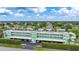 Aerial view of community with lush landscaping and canal views at 2486 Caring Way # 14A, Port Charlotte, FL 33952
