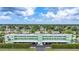 Aerial view of community with lush landscaping and canal views at 2486 Caring Way # 14A, Port Charlotte, FL 33952