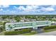 Aerial view of community with lush landscaping and canal views at 2486 Caring Way # 14A, Port Charlotte, FL 33952