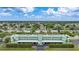Aerial view of community with lush landscaping and canal views at 2486 Caring Way # 14A, Port Charlotte, FL 33952