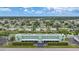 Aerial view of community with lush landscaping and canal views at 2486 Caring Way # 14A, Port Charlotte, FL 33952