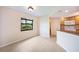 View of dining area with kitchen featuring stainless steel appliances and a breakfast bar at 2486 Caring Way # 14A, Port Charlotte, FL 33952