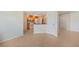 Bright kitchen with modern appliances and updated cabinets, seamlessly connecting to dining and living areas at 2486 Caring Way # 14A, Port Charlotte, FL 33952