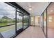 Enjoy water views from this screened lanai, featuring tile floors and multiple access points at 2486 Caring Way # 14A, Port Charlotte, FL 33952