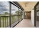 Large screened lanai overlooking a tranquil waterfront view and offering access to the indoors at 2486 Caring Way # 14A, Port Charlotte, FL 33952