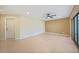 Bright living space with tile floors, recessed lighting, ceiling fan and access to exterior and kitchen at 2486 Caring Way # 14A, Port Charlotte, FL 33952