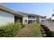 Well-maintained backyard with lush greenery, complemented by a patio perfect for outdoor relaxation at 26333 Nadir Rd # 111, Punta Gorda, FL 33983