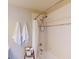 Shower and tub combination in a bright bathroom featuring a shower head and white shower curtain at 26333 Nadir Rd # 111, Punta Gorda, FL 33983
