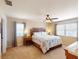Comfortable bedroom with neutral walls, carpet flooring, and a king-size bed at 26333 Nadir Rd # 111, Punta Gorda, FL 33983