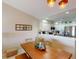 Cozy dining area adjacent to the kitchen, featuring a wood table and decor at 26333 Nadir Rd # 111, Punta Gorda, FL 33983