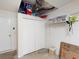 Spacious garage with ample storage, featuring a closet and overhead shelving for organization at 26333 Nadir Rd # 111, Punta Gorda, FL 33983
