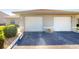 Dual garage doors for two-car parking with ample driveway space at 26333 Nadir Rd # 111, Punta Gorda, FL 33983