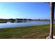 Scenic view of a serene lake within a lush community, promising tranquil living at 26333 Nadir Rd # 111, Punta Gorda, FL 33983