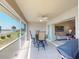 Comfortable lanai with a ceiling fan, table, and chairs offering indoor-outdoor living space at 26333 Nadir Rd # 111, Punta Gorda, FL 33983