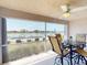 Lanai offering a view of the pool and the lake with outdoor dining furniture at 26333 Nadir Rd # 111, Punta Gorda, FL 33983