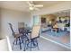 Outdoor dining set on lanai with open access to the home's living spaces at 26333 Nadir Rd # 111, Punta Gorda, FL 33983