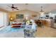 Bright living room seamlessly connects to a dining area and kitchen at 26333 Nadir Rd # 111, Punta Gorda, FL 33983