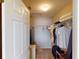 Spacious walk-in closet with shelving, rod hanging and carpet flooring at 26333 Nadir Rd # 111, Punta Gorda, FL 33983