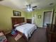 Cozy bedroom with a ceiling fan, a large window, and nice furniture at 2739 Sherman Oak Dr, North Port, FL 34289