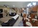 Open living space features modern furnishings and a seamless flow between the kitchen and dining areas at 2739 Sherman Oak Dr, North Port, FL 34289