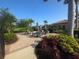 Outdoor patio with tables, chairs, landscaping, and a grill, perfect for community gatherings and enjoying the weather at 2739 Sherman Oak Dr, North Port, FL 34289