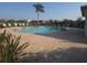Community pool with deck chairs, a palm tree, manicured grounds and several neighborhood homes at 2739 Sherman Oak Dr, North Port, FL 34289