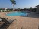 Community swimming pool with lounge chairs, creating a perfect spot for relaxation and enjoying sunny days at 2739 Sherman Oak Dr, North Port, FL 34289