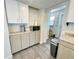 Cozy kitchen featuring modern appliances, stylish cabinets, and a convenient microwave on the counter at 3122 Scranton St, Port Charlotte, FL 33952